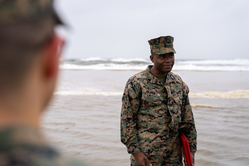 First Marine Corps District awards, reenlists Sgt. Kokou D. Adjogble