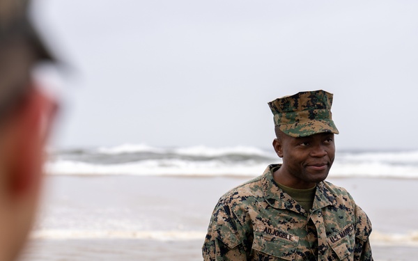First Marine Corps District awards, reenlists Sgt. Kokou D. Adjogble