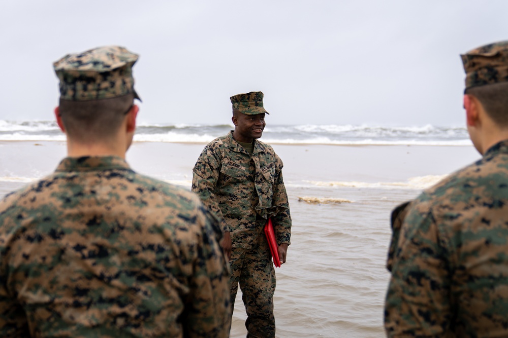 First Marine Corps District awards, reenlists Sgt. Kokou D. Adjogble