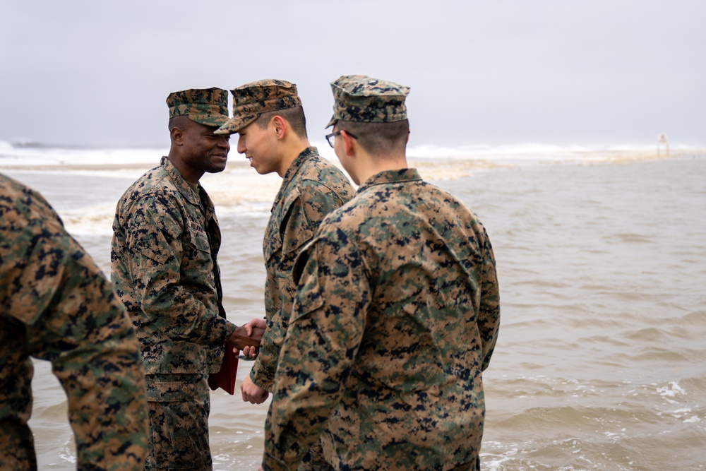 First Marine Corps District awards, reenlists Sgt. Kokou D. Adjogble