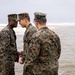 First Marine Corps District awards, reenlists Sgt. Kokou D. Adjogble