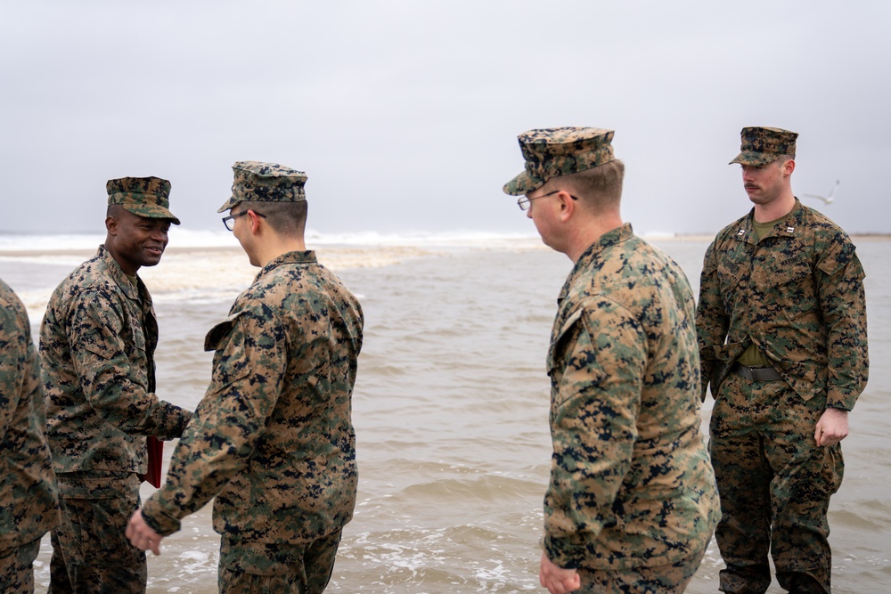 First Marine Corps District awards, reenlists Sgt. Kokou D. Adjogble