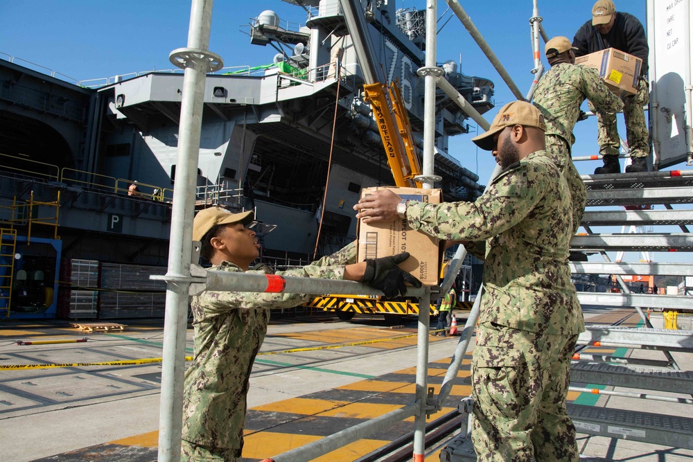 USS Ronald Reagan (CVN 76) Sailors transport cargo