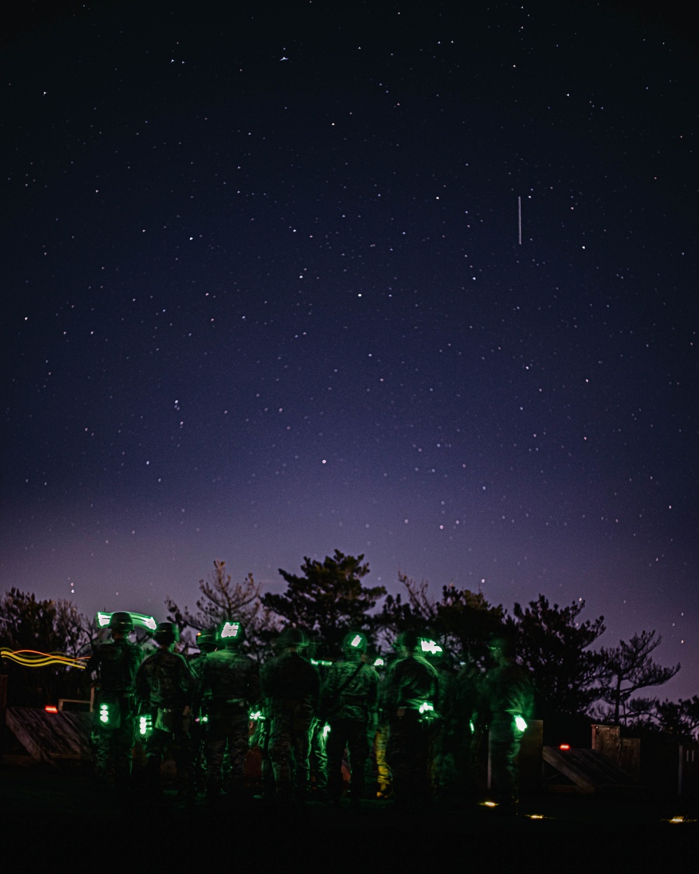 US Marines conduct a night range during the Marine Corps Marksmanship Competition Far East