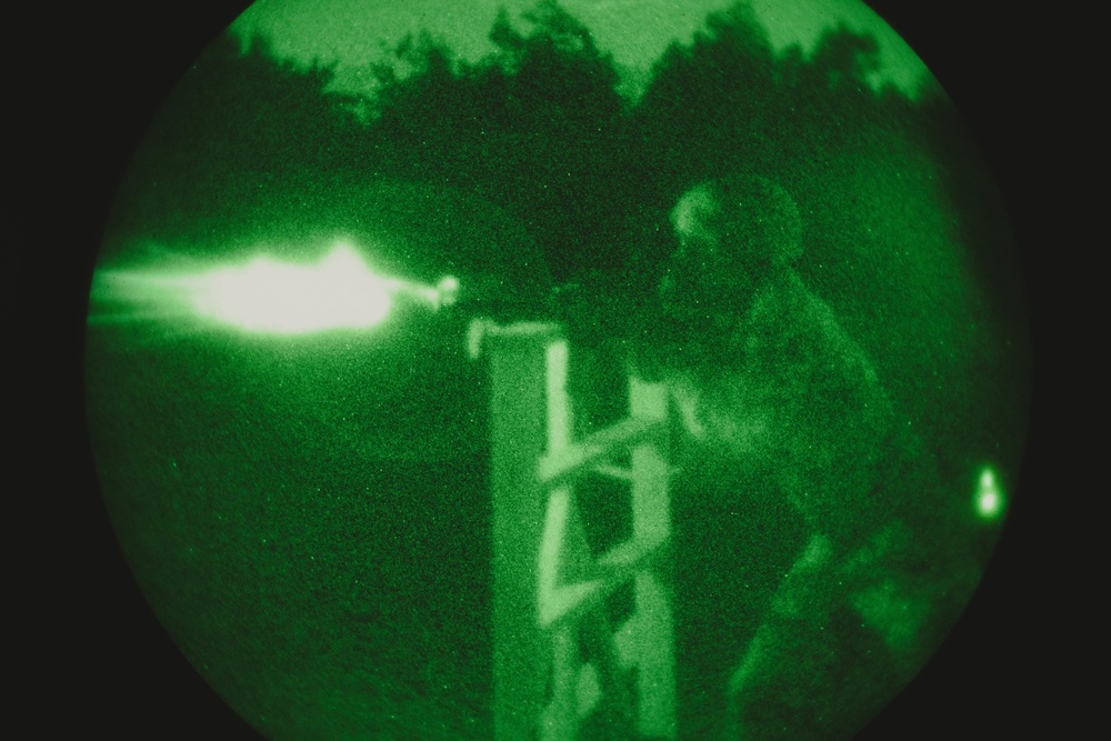 US Marines conduct a night range during the Marine Corps Marksmanship Competition Far East