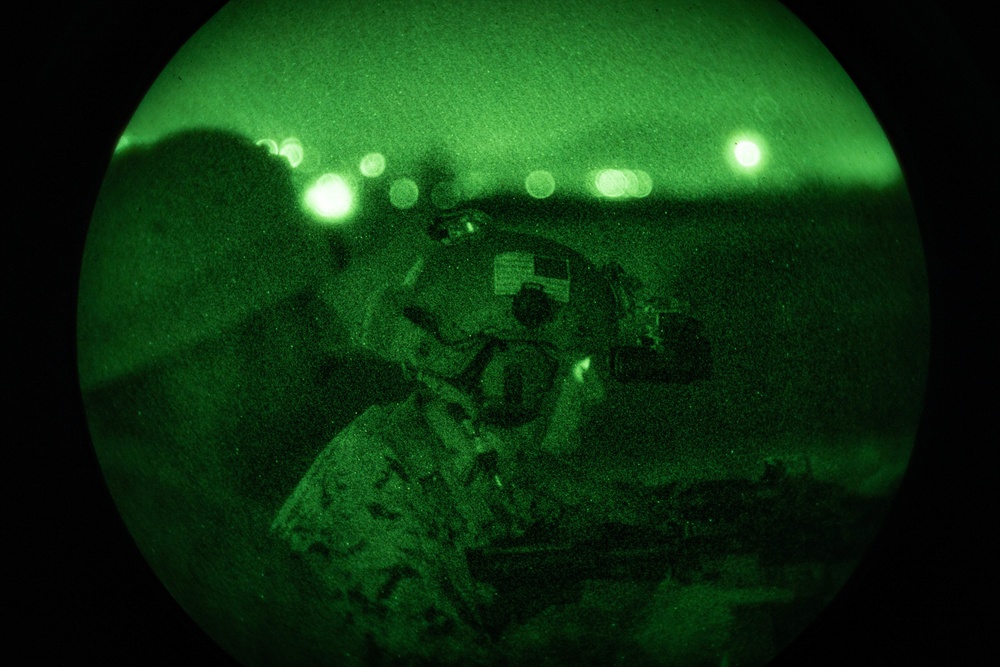 US Marines conduct a night range during the Marine Corps Marksmanship Competition Far East