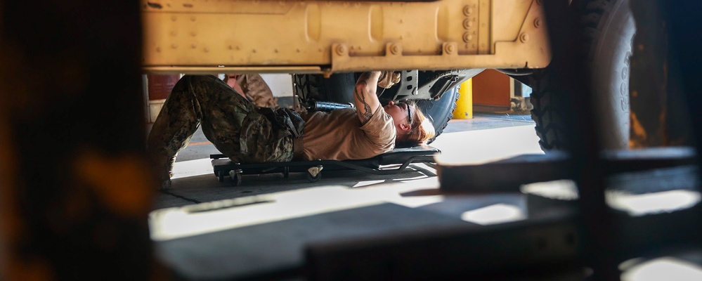 Seabee runs routine maintains HMMWV.