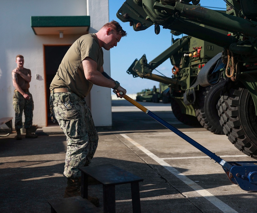 Construction Mechanic 3rd Class Dylan Baker of conducts maintenance.