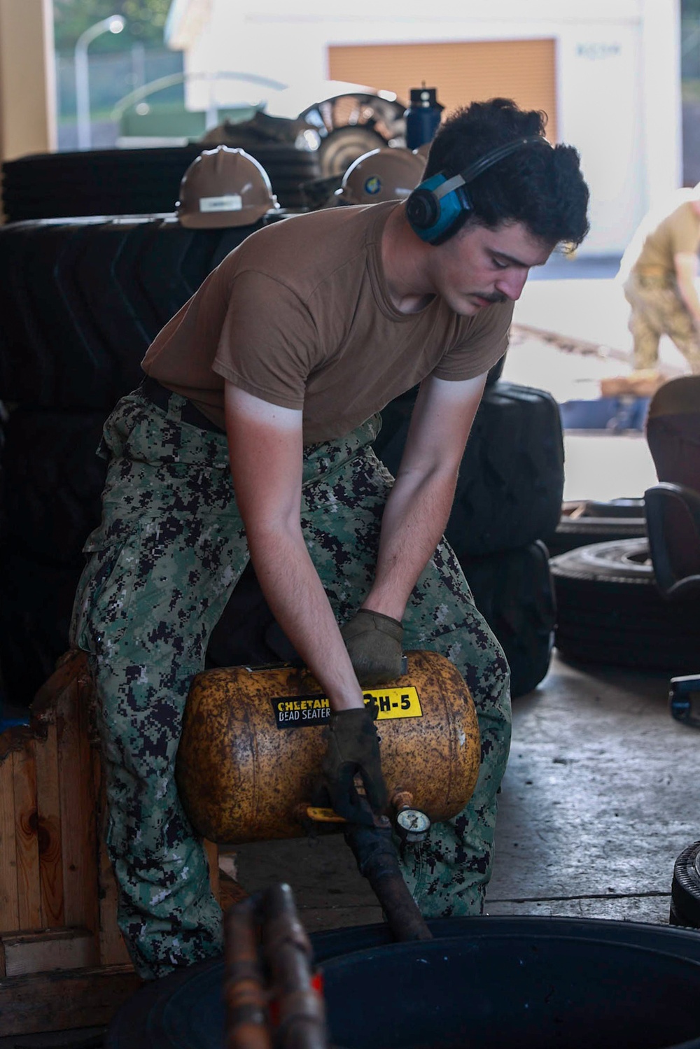 Seabee Changes Tire