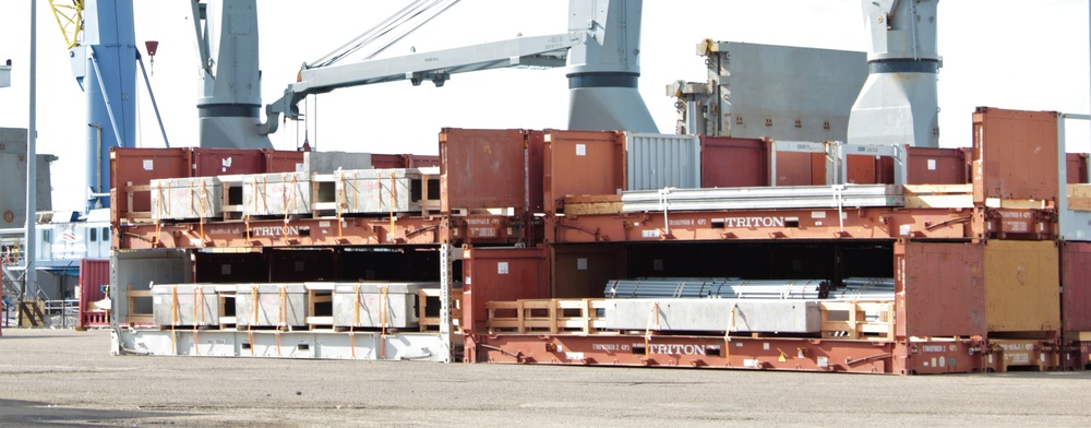 Materials prepared by NAVSUP FLC San Diego sit on the dock as port operations prepares to load them on MV Ocean Giant.