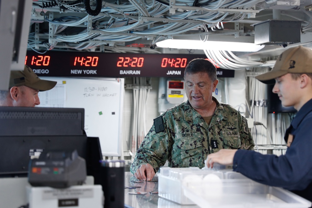 Vice Adm. Michael E. Boyle leads a tour of USS Abraham Lincoln (CVN 72)