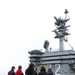 Vice Adm. Michael E. Boyle leads a tour of USS Abraham Lincoln (cv
