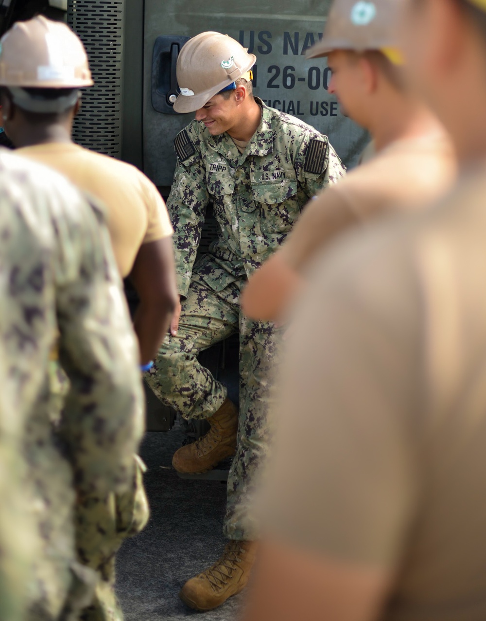 Seabees with Naval Mobile Construction Battalion Four receives training on the high pressure and large capacity piston concrete pump.