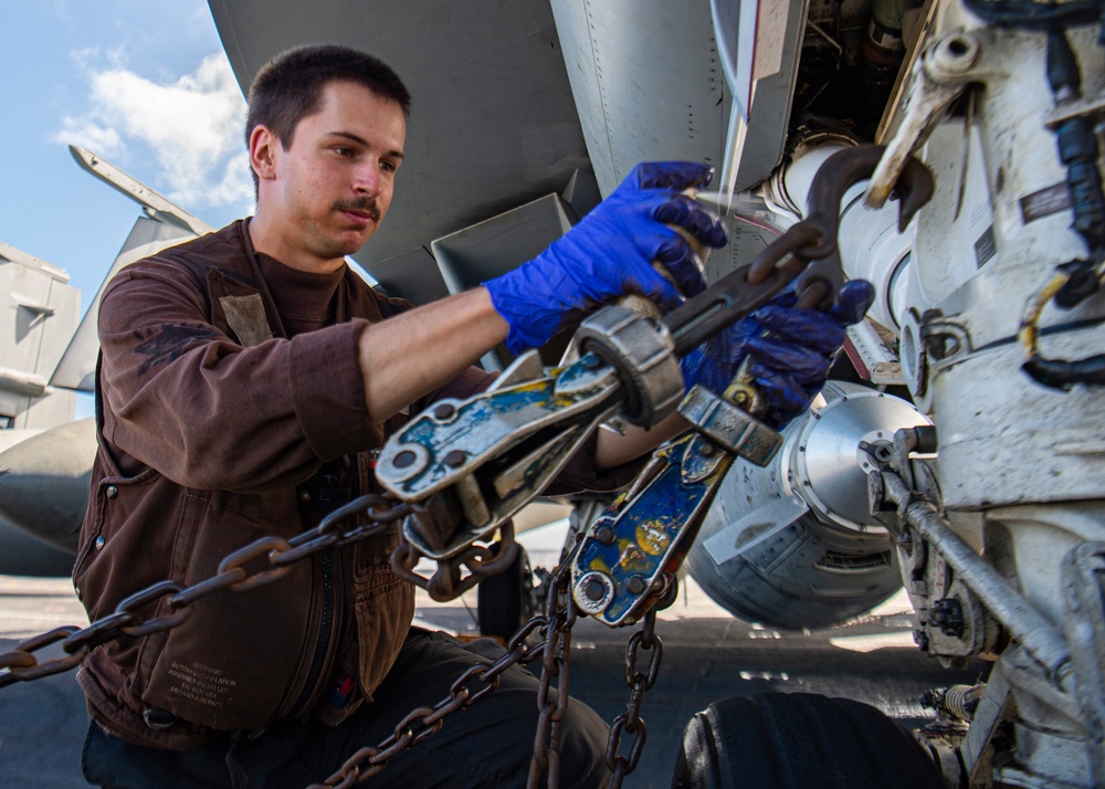 Sailor Performs Maintenance