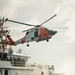 Coast Guard air and surface assets conduct a vertical insertion evolution