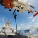 Coast Guard air and surface assets conduct a vertical insertion evolution