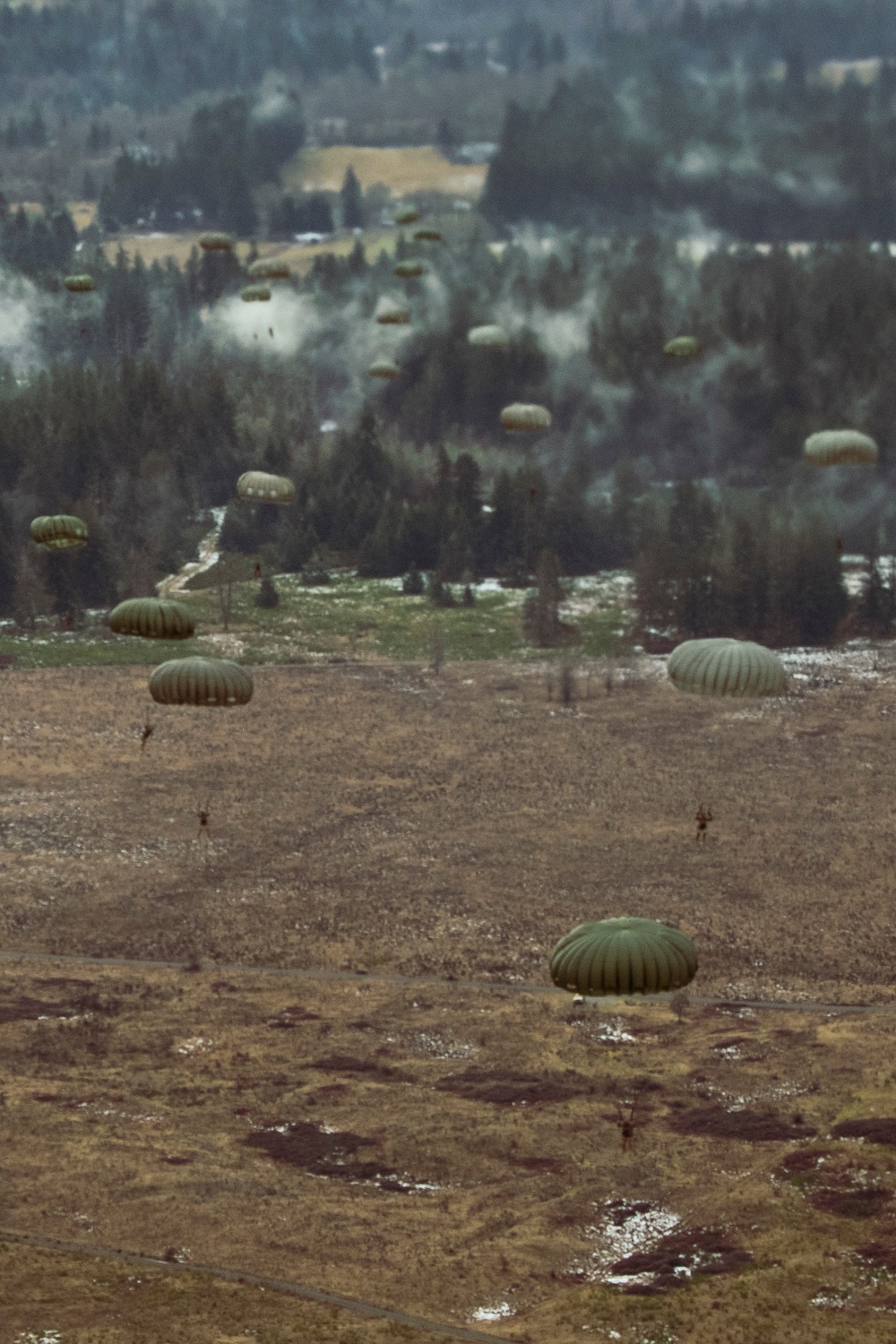 Drop zone drop-off: Washington National Guard pilots support special forces static line jumps