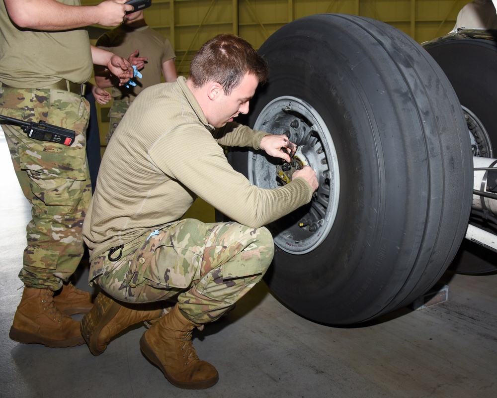 Airmen Perform Maintenance on Aircraft Brakes