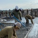 NMCB 11 Seabees and Georgian Engineers place concrete