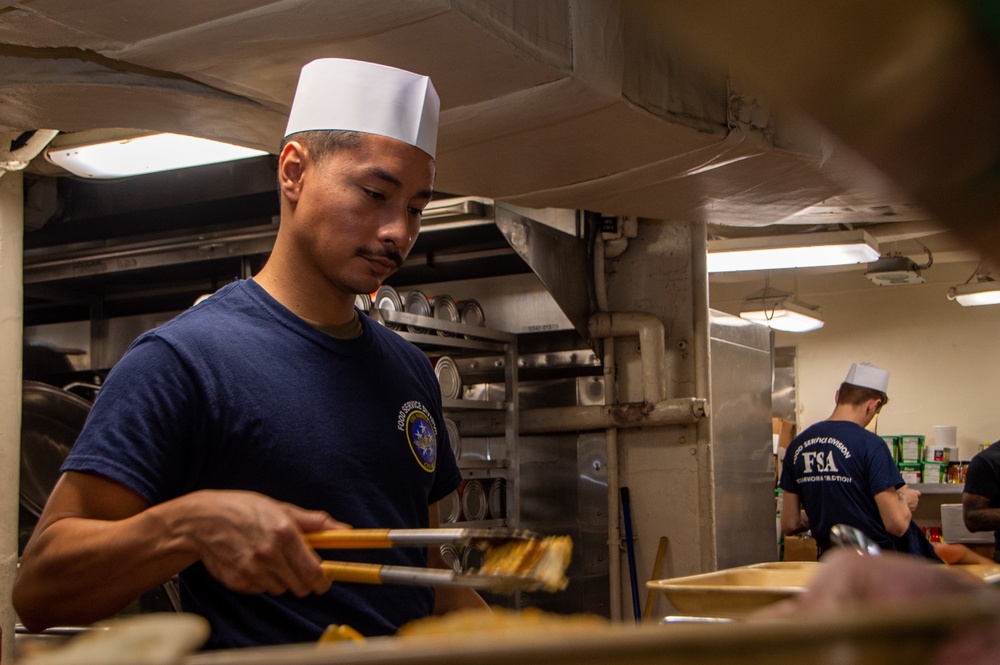 Sailor Serves Food