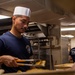 Sailor Serves Food