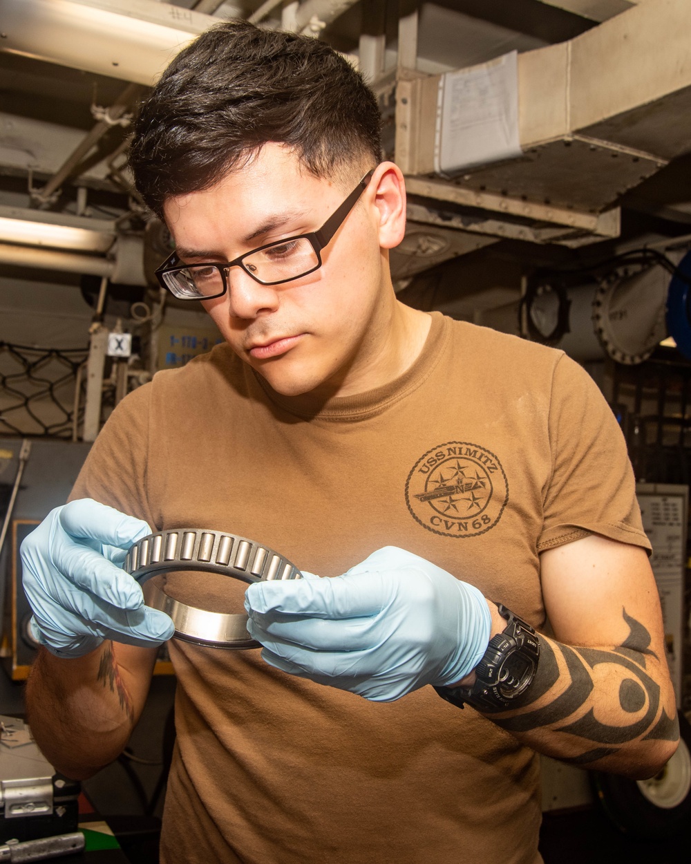 Sailor Inspects Bearings