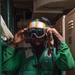 U.S. Navy Sailor Dons Flight Deck Gear