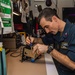 Sailor Performs Maintenance On A Sound Powered Amplifier