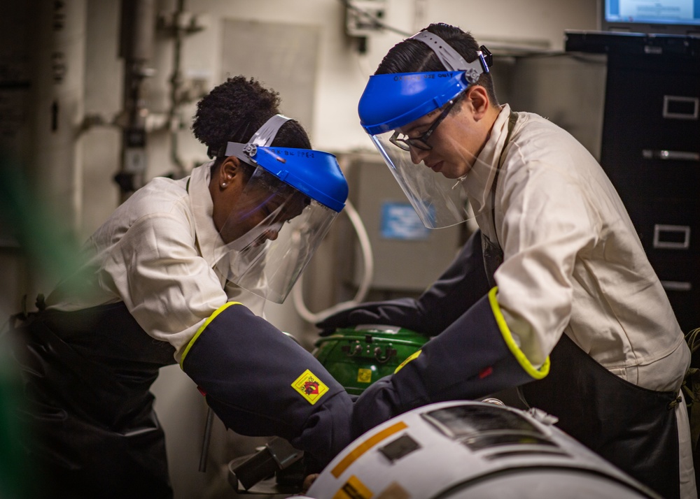 Sailors Perform Tests On A Liquid Oxygen Tank