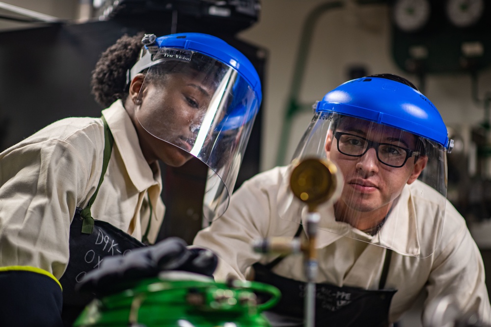 Sailors Perform Tests On A Liquid Oxygen Tank