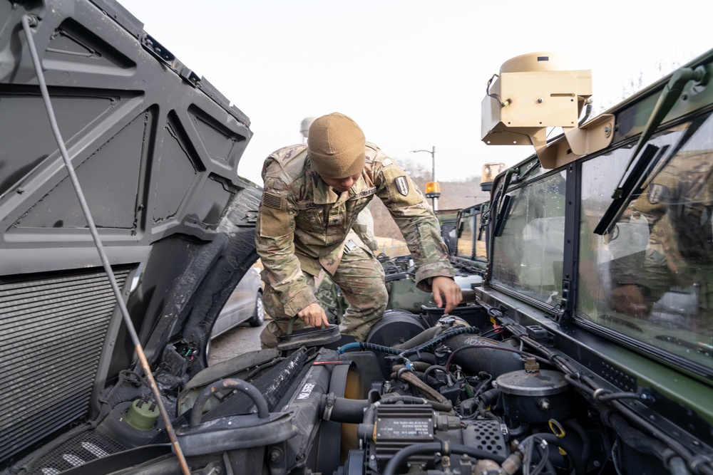 Charlie Company, 304th Expeditionary Signal Battalion soldiers assembling and maintaining signal equipment.