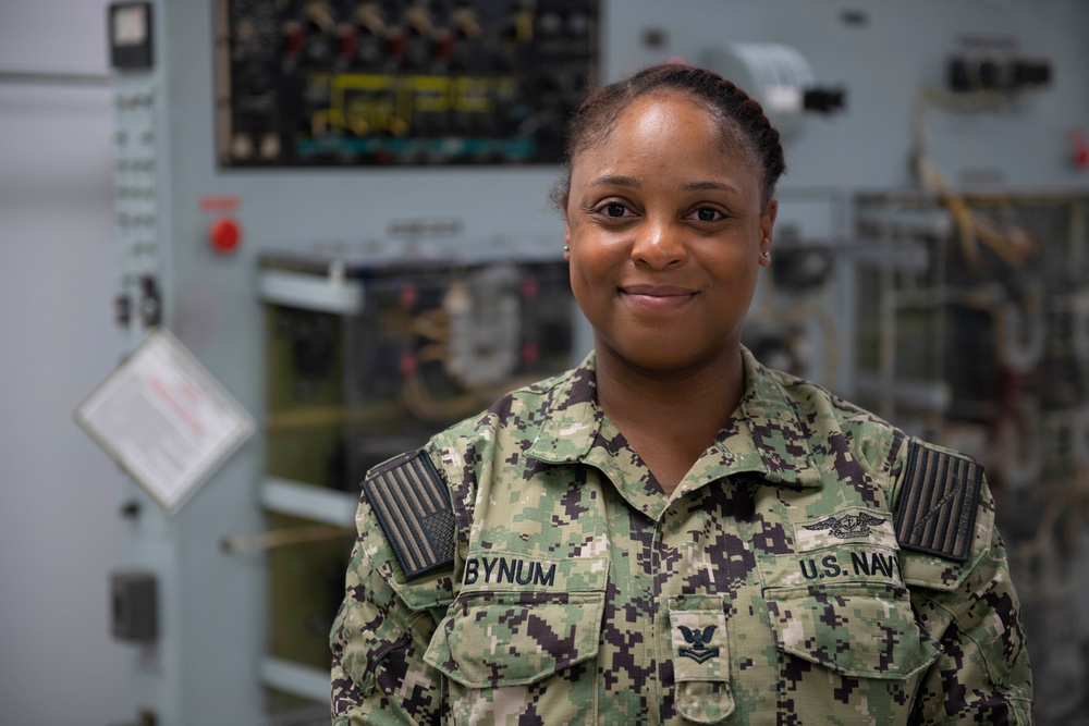 Aviation Electronics Technician 2nd Class Kayla Simpson Poses for a Portrait