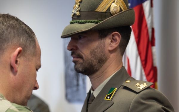 Commanding General Maj. Gen. Todd R. Wasmund presents Italian army Maj. Marco Nardi with the Meritorious Service Medal
