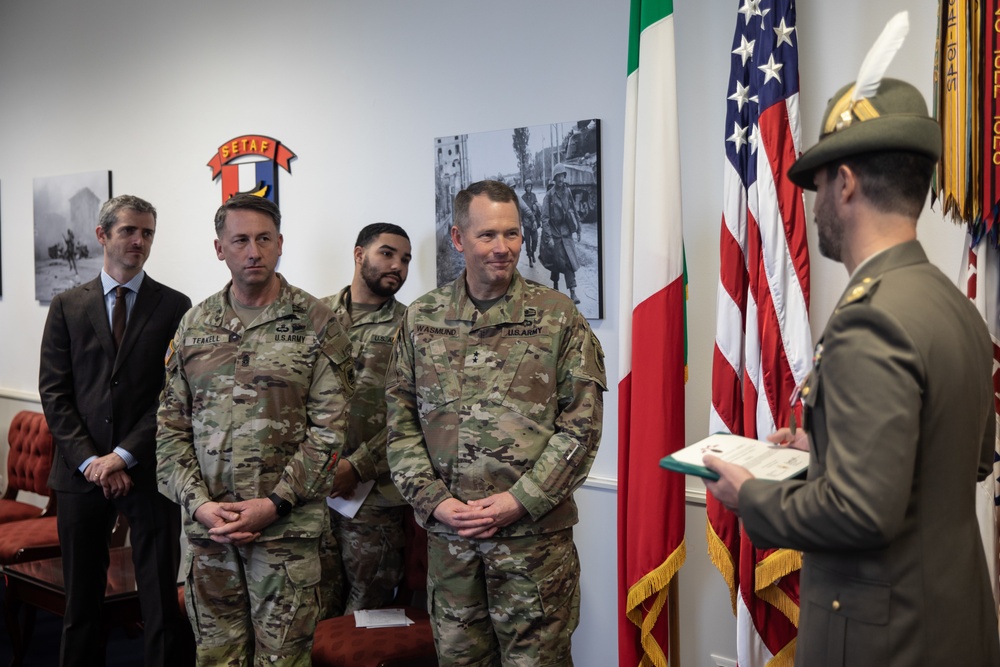 Commanding General Maj. Gen. Todd R. Wasmund presents Italian army Maj. Marco Nardi with the Meritorious Service Medal