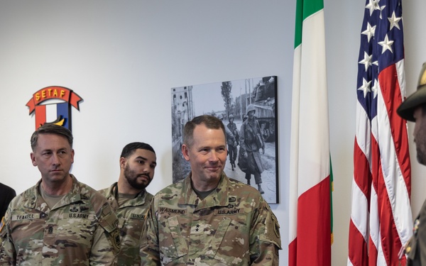 Commanding General Maj. Gen. Todd R. Wasmund presents Italian army Maj. Marco Nardi with the Meritorious Service Medal