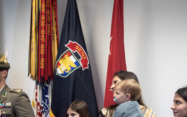 Commanding GeneralMaj. Gen. Todd R. Wasmund presents Italian army Maj. Marco Nardi with theMeritorious Service Medal