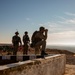 Members of Combined Joint Task Force - Operation Inherent Resolve share observation equipment