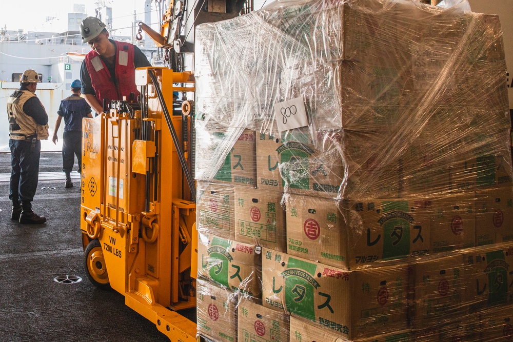 Sailor Operates Forklift