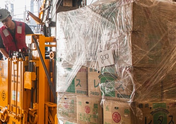 Sailor Operates Forklift
