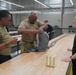 528th Special Troops Battalion and HHC Command Team learn how to pack chutes