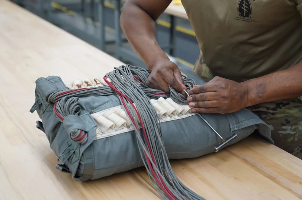 528th Special Troops Battalion and HHC Command Team learn how to pack chutes