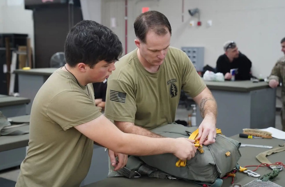 528th Special Troops Battalion and HHC Command Team learn how to pack chutes