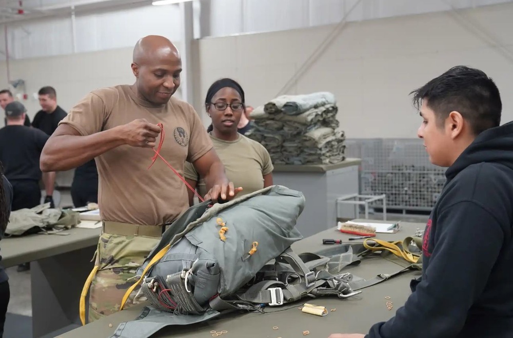 528th Special Troops Battalion and HHC Command Team learn how to pack chutes