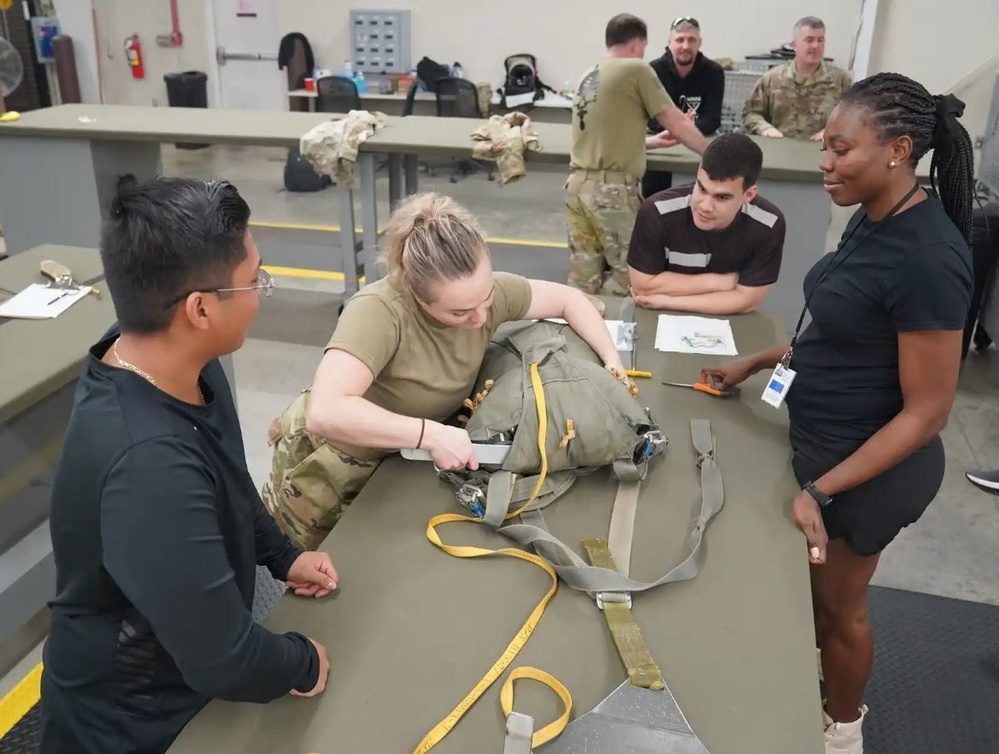 528th Special Troops Battalion and HHC Command Team learn how to pack chutes