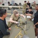 528th Special Troops Battalion and HHC Command Team learn how to pack chutes