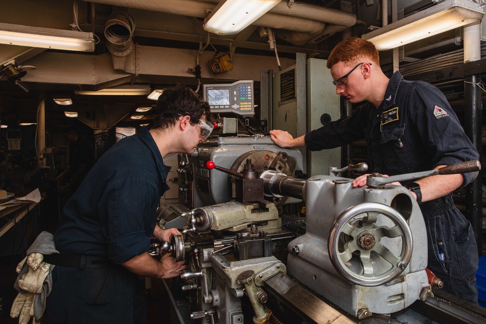 U.S. Sailors Grinds Iron