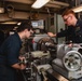 U.S. Sailors Grinds Iron