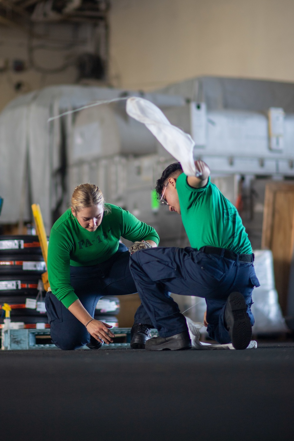 U.S. Navy Sailors Clean Padeyes