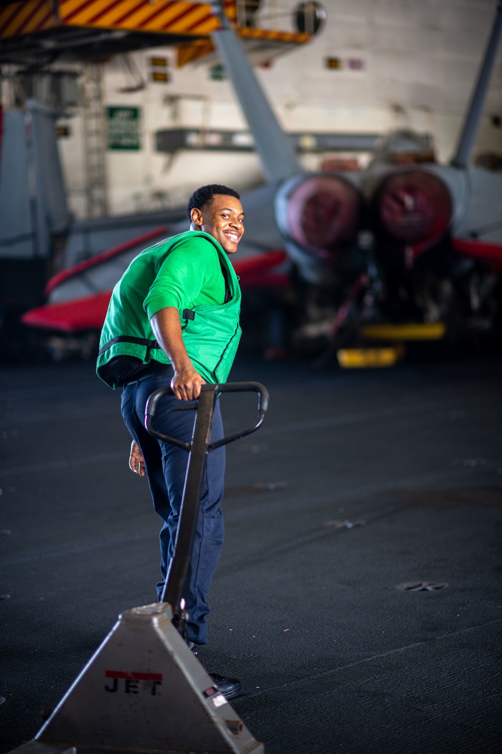 U.S. Navy Sailor Moves Pallet Jack