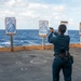 Sailor Fires Handgun During Live Fire Exercise